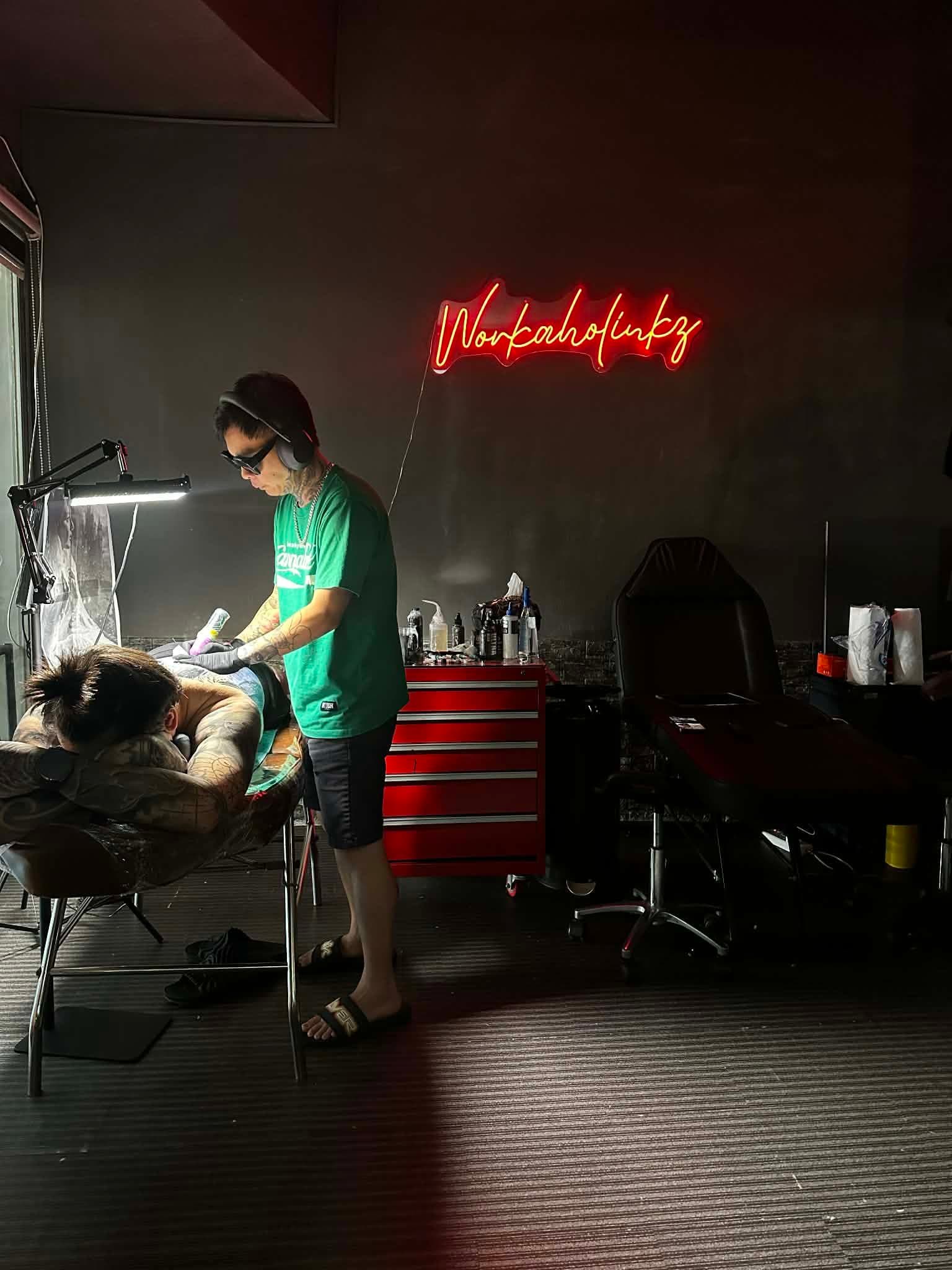 Tattoo session inside Workaholinkz Tattoo Studio
