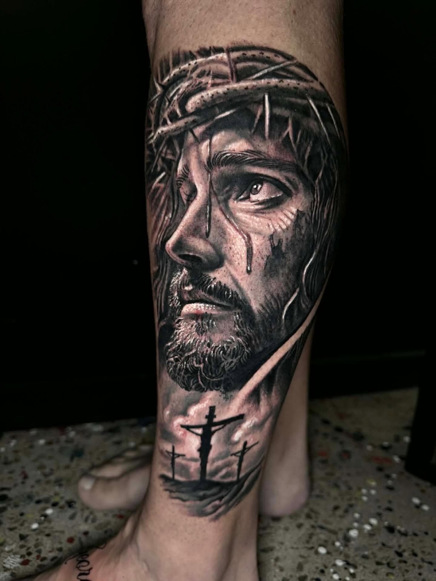 Black and grey portrait of Jesus with a crown of thorns on a calf